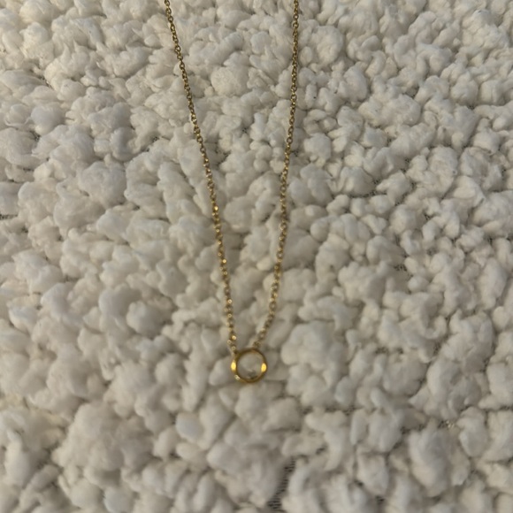 Dainty gold necklace with simple circle and singular diamond. - Picture 4 of 4